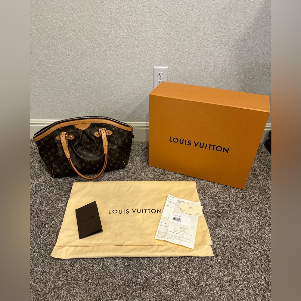 Authentic Monogram Tivoli GM Handbag in Pristine Condition.